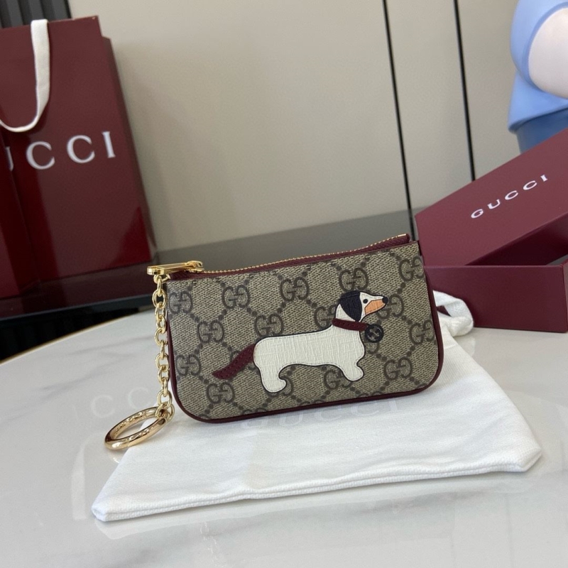 G*u*i clutch bags